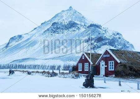 Icelandic turf houses in Arnarstapi. Arnarstapi or Stapi is a small fishing village, Snaefellsnes ,  Iceland.