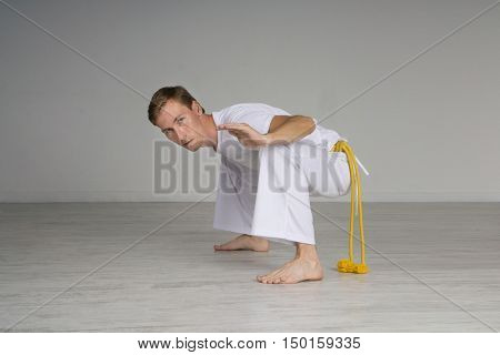 Man practicing capoeira , brazilian martial art.