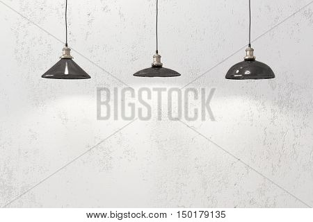 Industrial loft pendant lamps against rough wall
