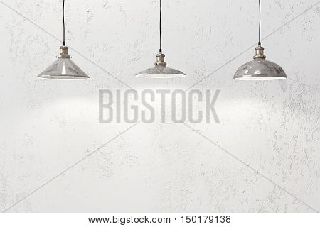 Industrial loft pendant lamps against rough wall
