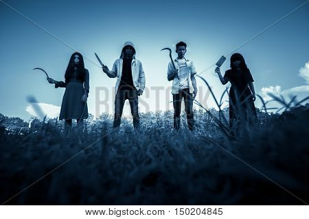 Group of stranger people with weapon to prank on halloween,Scary background for book cover