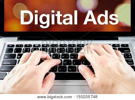 Digital Ads Word On Laptop Screen With Hand Type On Keyboard, Digital Advertising Concept
