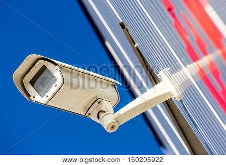closeup on security CCTV camera or surveillance system in office building