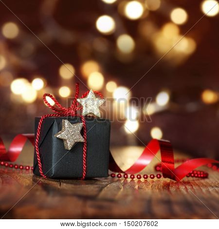 Very beautiful Christmas package in front of Starlights with bokeh