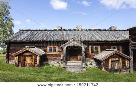 HARJEDALEN, SWEDEN ON JULY 07. View of an outdoor museum, wooden homestead on July 07, 2016 in Harjedalen, Sweden. Rustic buildings in log, timber construction from 17th. Editorial use.