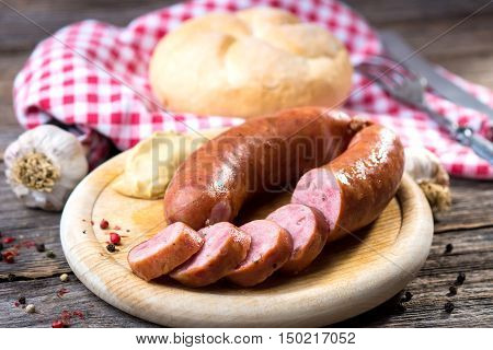 Boiled Sausages On Rustic Round Wooden Board