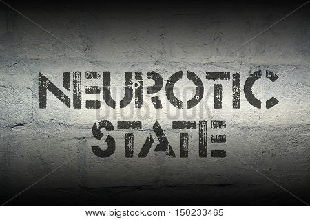 neurotic state stencil print on the grunge white brick wall