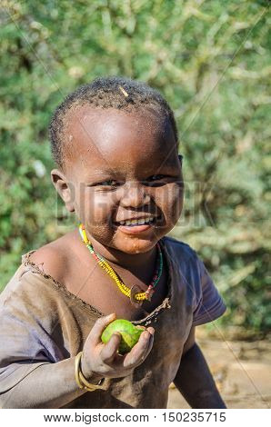 LAKE EYASI, TANZANIA - MAY 29, 2015: Cute kid from a datoga tribe at Lake Eyasi Tanzania