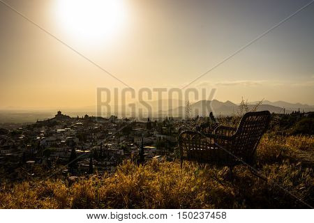 A chair at a lookout. Sit down and relax. Do nothing for awhile, just breathe and see the how the Sun goes down.