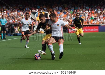 VALENCIA, SPAIN - OCTUBER 2nd: (L) Correa (R) Gaya during Spanish soccer league match between Valencia CF and Atletico de Madrid at Mestalla Stadium on Octuber 2, 2016 in Valencia, Spain