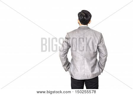 Back view of standing businessman looking in distand isolated on white background