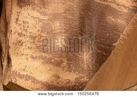 Petroglyph or rock art carvings of Native Americans on a canyon wall in Freemont National Park Capitol Reef Utah USA