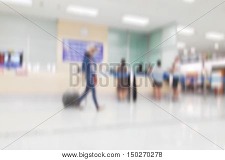 white blurred of department store background. Defocused blur background / Abstract blur shopping mall store interior for background / Corridor in airport out of focus