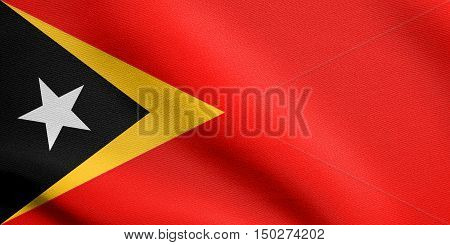 East Timorese national official flag. Patriotic symbol banner element background. Accurate dimensions. Correct size colors. Flag of East Timor waving in the wind with detailed fabric texture, 3d illustration
