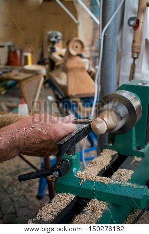 A man working wood with turner carpentry