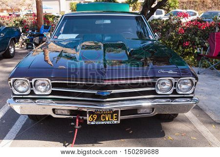 Green and blue 1969 Chevy Chevelle owned by John Pettinato and displayed at the Rotary Club of Laguna Beach 2016 Classic Car Show. Editorial use.