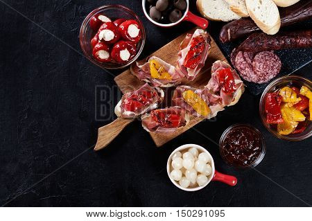 Spanish Tapas With Slices Jamon Serrano And Grilled Pepper. Also