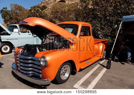 Laguna Beach, CA, USA - October 2, 2016: Orange 1948 Chevy Truck owned by Tim Timmerman and displayed at the Rotary Club of Laguna Beach 2016 Classic Car Show. Editorial use.