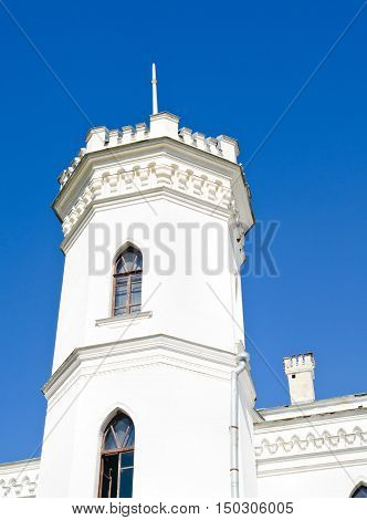 The White Swan palace on blue sky in Sharovka Ukraine