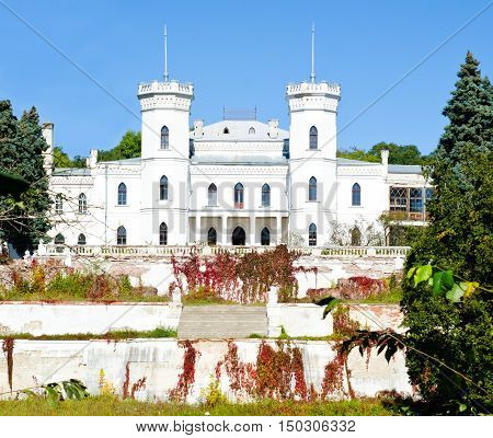 The White Swan palace on blue sky in Sharovka Ukraine