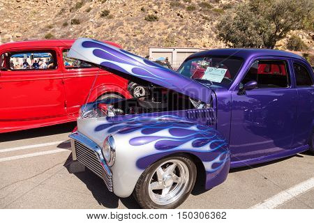 Laguna Beach, CA, USA - October 2, 2016: Blue with silver flames 1946 Studebaker Champion owned by Jim Magill and displayed at the Rotary Club of Laguna Beach 2016 Classic Car Show. Editorial use.
