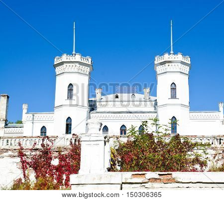 The White Swan palace on blue sky in Sharovka Ukraine