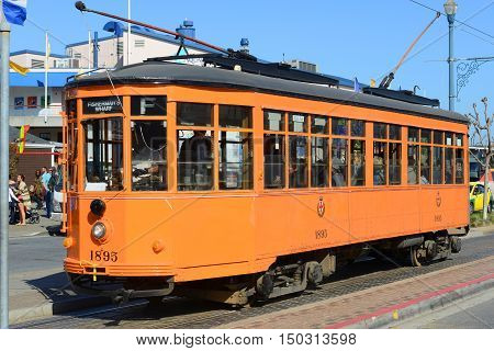 SAN FRANCISCO - MARCH 14: F-line Antique Peter Witt streetcar No.1895 Milan (Italy) in Fisherman's Wharf on March 14th, 2014 in San Francisco, California, USA.