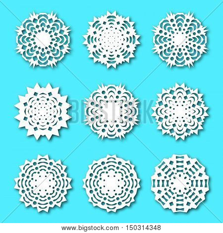 Set paper snowflakes with shadow isolated on a blue background. Graphic material and design elements to decorate Christmas cards backgrounds posters vector illustration.