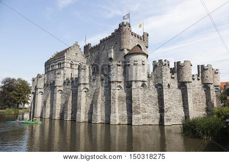 canoes near castle gravensteen in belgium medieval city of ghent