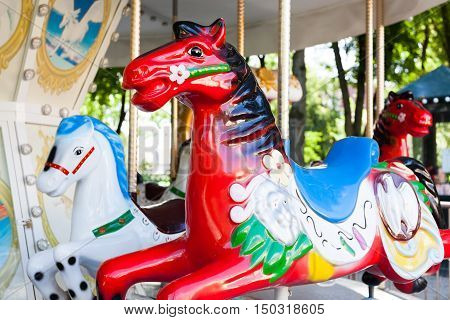 Red old carousel Horse in the park