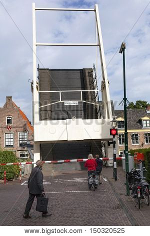 Maarssen, Netherlands, 30 september 2016: old wooden drawbridge and waiting people in centre of Maarssen