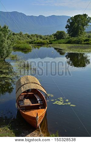 An old boat moored at Virpazar on Skadarsko Jezero or Lake Skadar in Montenegro.