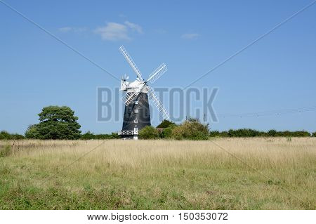BURNHAM OVERY STAITHE, UK - AUGUST 30, 2016: The tower Windmill, built in 1816 was used as a corn ill until damaged by a storm, Norfolk, UK