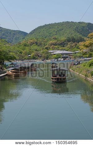 KYOTO, JAPAN - APRIL 30 , 2016: boats in the river at Arashiyama, Kyoto, Japan. Arashiyama  , Scenic Beauty and Historic .  Kyoto, Japan. APRIL 29 2016.