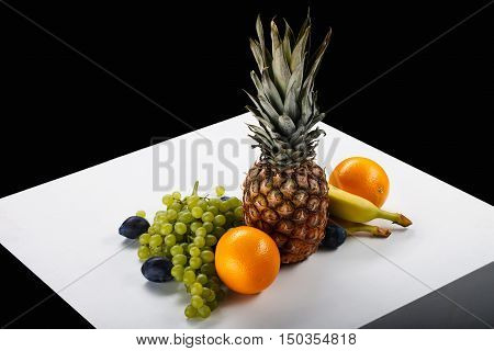 Fruit Bowl On A White Table And On A Black Background In The Photo Studio. Vitamin Deser. Bananas, P