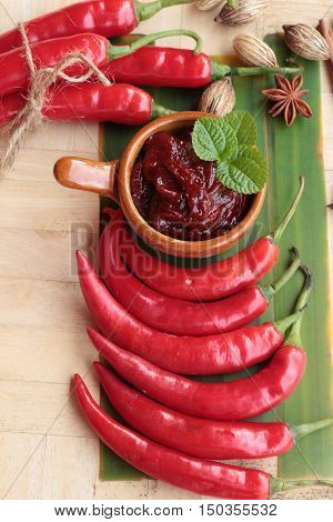 Korean red pepper gochujang for cooking on wood background