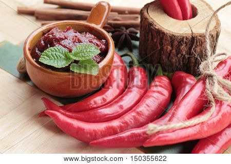 Korean red pepper gochujang for cooking on wood background