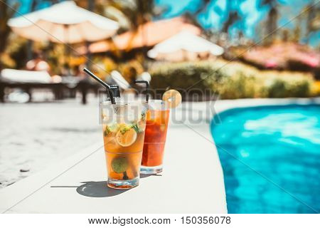Close-up Of Mojito Cocktail Drink, Selective Focus And Details. Alcoholic Drink Refreshment At Pool