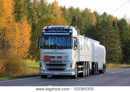 SALO, FINLAND - OCTOBER 2, 2016: New Volvo FH fuel tank truck on rural road in autumn. The ADR code 33-1203 signifies gasoline.