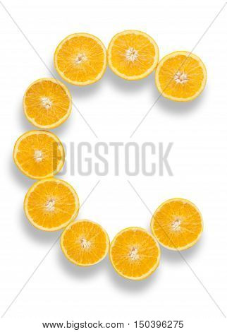 Vitamin C letter made from orange halves over a white background
