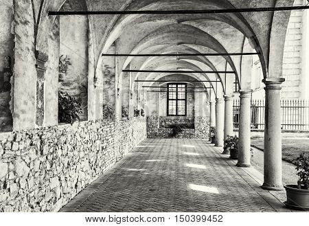 Medieval arcade corridor at Telc castle Czech republic. Black and white photo. Architectural scene. Unesco World Heritage Site. Travel destination. Beautiful place.