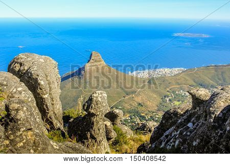 Table Mountain National Park, Trail Hike. The plateau, flanked by Devil's Peak to the east and by Lion's Head to the west, forms a backdrop to Cape Town.