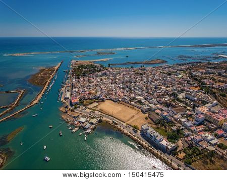 Aerial view of Fuzeta with coastline and docks, Algarve, Portugal,