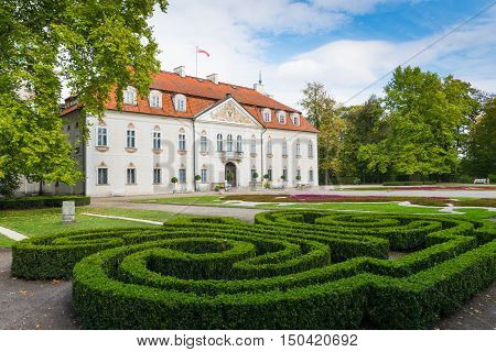 Nieborow Poland - September 30 2016: Back view of Radziwill family palace of Nieborow in baroque style surrounded by a french garden.