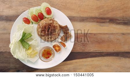 rice with fried mackerel boil egg shrimp paste chili sauce and vetgetable and fish fry original thai food