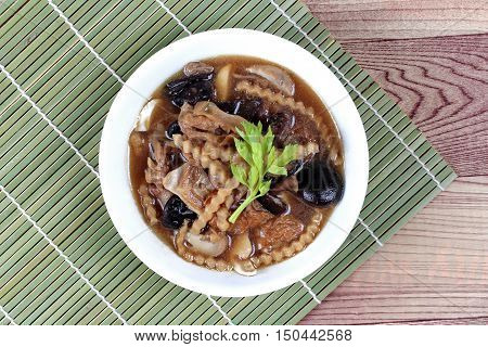Mixed vegetable and tofu sheet (mushroom ,fermented flour,bamboo shoot,tapioca flour,celery in brown soup call 