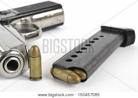 Pistol and ammunition on the white background.