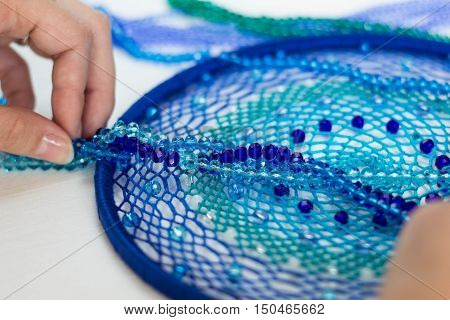 set for making a Dreamcatcher beads thread on a white background