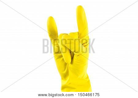 Woman's hand in yellow rubber gloves shows 'Horns Up' sighn. Fun house keaping concept