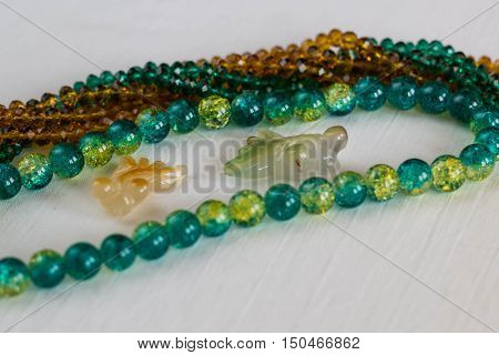Colorful gems and beads in white background